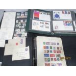 An album of British stamps along with worldwide , Norwegian and first day covers
