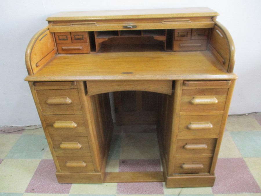 An oak roll top desk