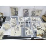 A collection of vintage photographs of film stars, some signed