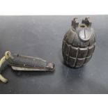 A money box formed from a Mills hand grenade (marked G3) along with a WWII folding knife