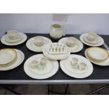 A collection of Susie Cooper dinner and tea ware along with four Clarice Cliff Bizarre bowls