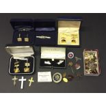 A collection of badges, cuff links (including silver) etc