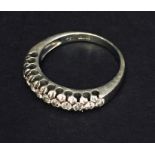 An 18ct white gold half eternity ring set with diamonds. Weight 4.3g