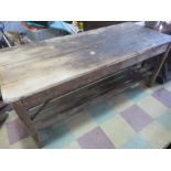 A vintage pine workbench/table with metal supports, approx 6 ft length