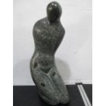 A polished granite kneeling figure approx 43cm height