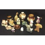A collection of Wade Whimsies, Satsuma, Doulton etc.
