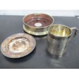 A George III hallmarked silver Christening mug along with a wine coaster inset with silver and a