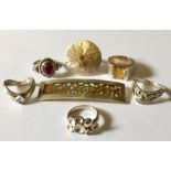 A collection of 925 silver rings along with a silver brooch.