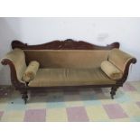 A Victorian scroll end sofa with carved decoration