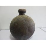 An antique metal water vessel