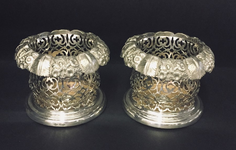 An ornate pair of silver plated wine coasters - Roberts & Slater, Birmingham, Circa 1850