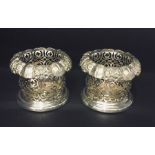 An ornate pair of silver plated wine coasters - Roberts & Slater, Birmingham, Circa 1850