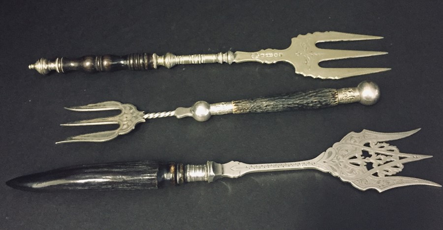 Three horn handled muffin forks