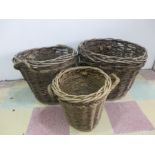 Three wicker log baskets