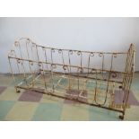 A vintage wrought iron French cot