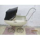 A coach built style dolls pram