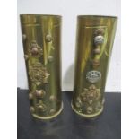 A pair of trench art brass shells (105mm)brought back from the Falkland Islands decorated with