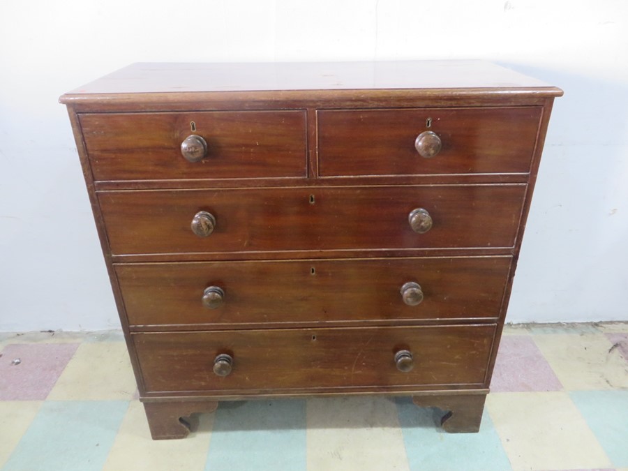 A Victorian chest of five drawers, back foot loose but present