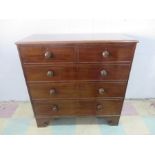 A Victorian chest of five drawers, back foot loose but present