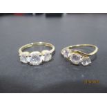 Two 14ct gold three stone rings both set with CZ's