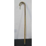 An early 20th Century bamboo walking stick with concealed horse measuring stick inside in