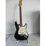 An Eastcoast electric guitar signed by Michael Jackson - certificate in office