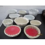 A collection of pottery jelly and blancmange moulds