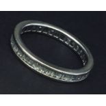 An 18ct white gold eternity ring set with baguette diamonds.