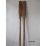 A pair of vintage wooden oars