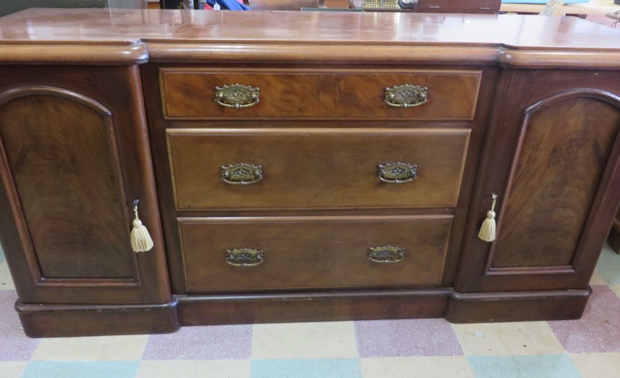 A Victorian sideboard/dresser base with two cupboard and three drawers - two keys in office