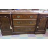 A Victorian sideboard/dresser base with two cupboard and three drawers - two keys in office