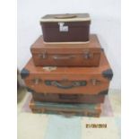 Four vintage suitcases and a vanity case