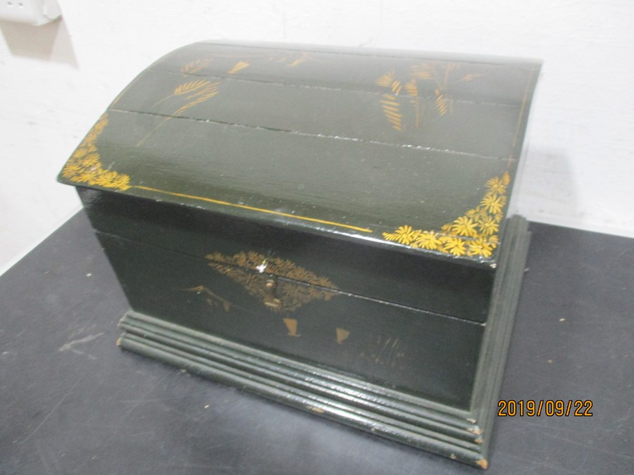 A small wooden dome topped trunk painted with Chinoiserie decoration