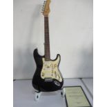 An Eastcoast electric guitar signed by Oasis - certificate in office