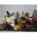 A collection of pottery jugs, chicken crocks etc.