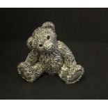 A 925 silver model of a teddy bear.