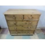 An antique pine chest of drawers