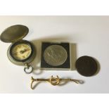 A vintage compass, Cartwheel penny, stock pin etc