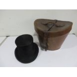 A Dunn & Co top hat in leather case