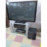 A Panasonic 50 inch TV on stand with sound system, sky box and Blue Ray player