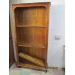 A tall pine bookcase
