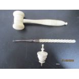 An antique ivory gavel along with a finial etc.