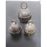 A set of three bronzed cow bells