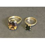 An 18ct gold ring set with a smokey topaz along with an unmarked high set gold ring.