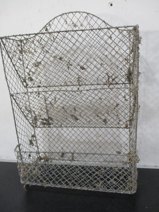 A vintage wirework hanging shelf