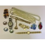 A collection of costume jewellery , including Murano and various watches.