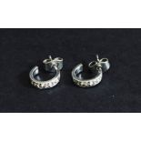 A pair of 14ct white gold earrings set with diamonds