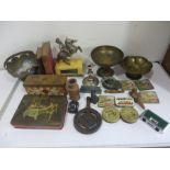 A collection of miscellaneous items including brass ware, bottle stoppers, vintage tins etc