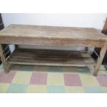 A vintage pine workbench/table with metal supports, approx 6 ft length