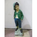 A plaster figure of a boy